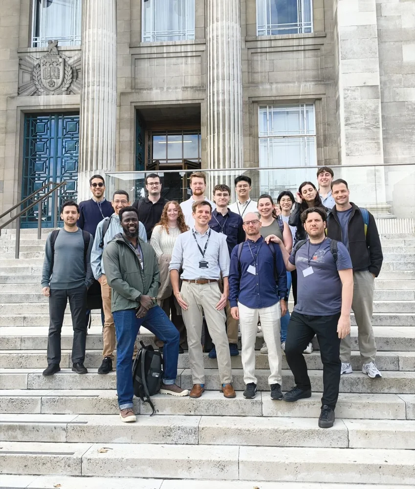 Group photo of COSUR 2026 speakers and participants on the steps of the University of Leeds